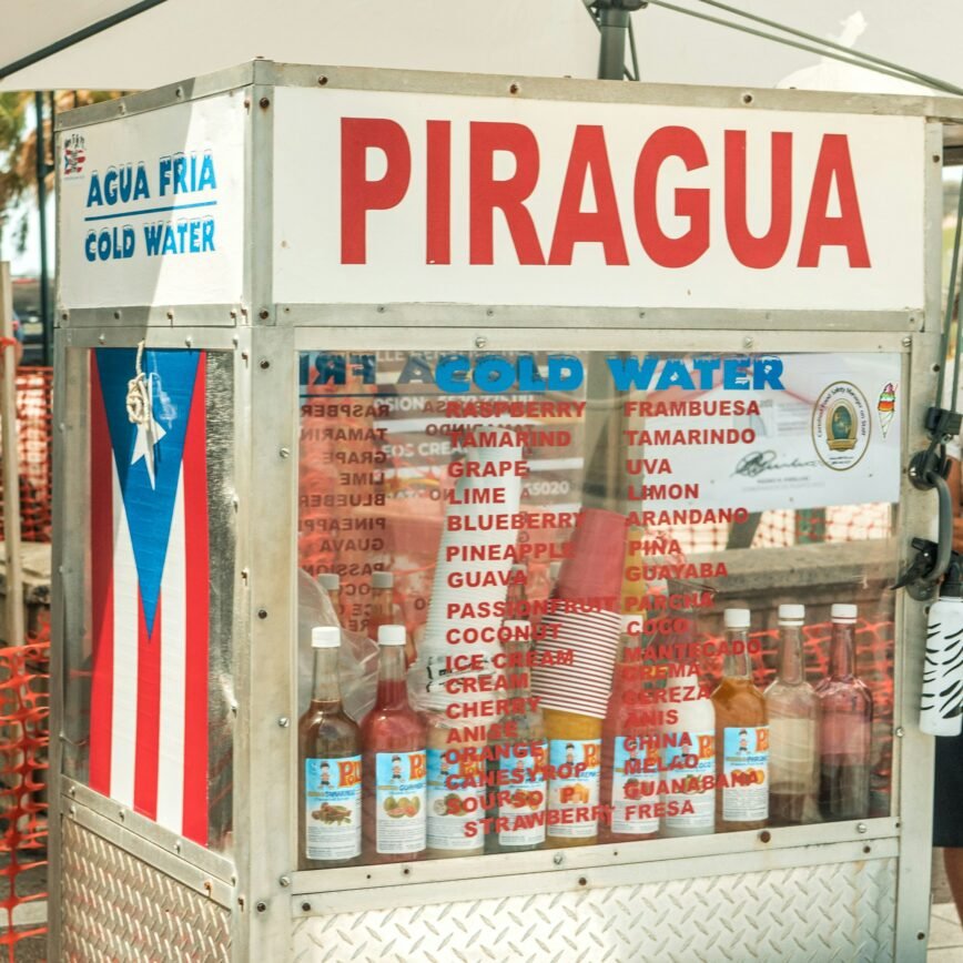 Piragua stand (Puerto Rican snow cone) in Puerto Rican colors with a Puerto Rican flag on the side of it